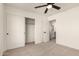 Bedroom with carpet, ceiling fan, and closet provides comfortable living and ample storage space at 8928 E Crescent Ave, Mesa, AZ 85208