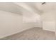 Bright, neutral carpeted bonus room with white trim at 8928 E Crescent Ave, Mesa, AZ 85208