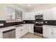 Modern kitchen with stainless steel appliances, sleek countertops, stylish backsplash, and a window above the sink at 8928 E Crescent Ave, Mesa, AZ 85208
