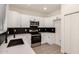 Modern kitchen featuring stainless steel appliances, sleek countertops, and ample cabinet space at 8928 E Crescent Ave, Mesa, AZ 85208