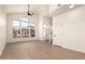 Bright living room with a vaulted ceiling, modern flooring, and a large window that brings in plenty of natural light at 8928 E Crescent Ave, Mesa, AZ 85208