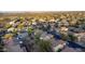 An aerial view of desert homes with mountain views features lush vegetation and manicured landscapes at 9548 E Kiva Ln, Gold Canyon, AZ 85118