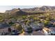 Aerial view of a two-story home with a private pool in a picturesque mountain community at 9548 E Kiva Ln, Gold Canyon, AZ 85118