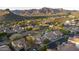 Beautiful golf course and desert mountain community aerial with a community pool at 9548 E Kiva Ln, Gold Canyon, AZ 85118
