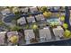 This aerial view shows a quiet neighborhood with a community pool and well-maintained houses at 9548 E Kiva Ln, Gold Canyon, AZ 85118