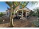 Spacious backyard featuring a covered patio, desert landscaping, and BBQ perfect for entertaining at 9548 E Kiva Ln, Gold Canyon, AZ 85118