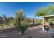 Expansive backyard featuring desert landscaping, mountain views, and a covered patio for outdoor entertaining at 9548 E Kiva Ln, Gold Canyon, AZ 85118