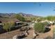 Relaxing backyard setting with lush desert landscaping and mountain views at 9548 E Kiva Ln, Gold Canyon, AZ 85118