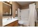 Well-lit bathroom features a single sink, wood cabinets, and shower/tub combination at 9548 E Kiva Ln, Gold Canyon, AZ 85118