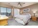 Well-lit bedroom features a ceiling fan, closet, and a window for natural light at 9548 E Kiva Ln, Gold Canyon, AZ 85118
