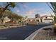 Gated community entrance with desert landscaping, and tile roofed homes at Vista Point in Scottsdale, Arizona at 9548 E Kiva Ln, Gold Canyon, AZ 85118