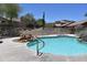 Beautiful community pool with desert landscaping and plenty of room for residents to enjoy at 9548 E Kiva Ln, Gold Canyon, AZ 85118
