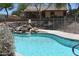 Community pool and small decorative waterfall feature for resident enjoyment at 9548 E Kiva Ln, Gold Canyon, AZ 85118