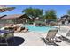 Inviting community pool area with ample seating and desert landscaping at 9548 E Kiva Ln, Gold Canyon, AZ 85118