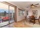 Bright dining area with wood floors and mountain views through sliding glass doors and windows at 9548 E Kiva Ln, Gold Canyon, AZ 85118