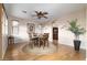 Dining room featuring hardwood floors, a round table with four chairs, and stylish decor at 9548 E Kiva Ln, Gold Canyon, AZ 85118