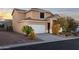 Southwest style home with a tile roof, two car garage and desert landscaping, located in Scottsdale, Arizona at 9548 E Kiva Ln, Gold Canyon, AZ 85118