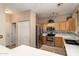 Functional kitchen featuring stainless steel appliances, wooden cabinets, and ample counter space at 9548 E Kiva Ln, Gold Canyon, AZ 85118