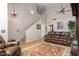 Open living room features wood floors, stairs to the second level, and leather sofa at 9548 E Kiva Ln, Gold Canyon, AZ 85118