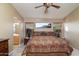 Bedroom with mountain views, neutral paint, bedside tables, and ensuite bathroom at 9548 E Kiva Ln, Gold Canyon, AZ 85118
