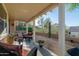 Relaxing covered patio with comfortable seating and desert landscaping offering a serene outdoor living space at 9548 E Kiva Ln, Gold Canyon, AZ 85118