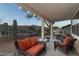 Cozy covered patio featuring comfortable seating, a grill, and scenic views, ideal for outdoor gatherings at 9548 E Kiva Ln, Gold Canyon, AZ 85118