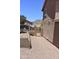 A low maintenance side yard with desert landscaping and a gated entrance at 9548 E Kiva Ln, Gold Canyon, AZ 85118