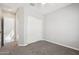Comfortable bedroom with carpeted floors, closet and neutral color palette at 10158 W Angels Ln, Peoria, AZ 85383