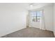 Bright bedroom with neutral colors, plush carpeting, and a ceiling fan at 10158 W Angels Ln, Peoria, AZ 85383