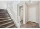 Foyer with staircase, wood-look tile floor, and access to additional rooms at 10158 W Angels Ln, Peoria, AZ 85383
