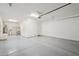 Spacious two car garage with gray epoxy floors, water heater, and room for storage at 10158 W Angels Ln, Peoria, AZ 85383