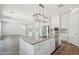 Kitchen island with granite countertops, pendant lighting, and stainless steel appliances at 10158 W Angels Ln, Peoria, AZ 85383