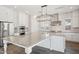 Spacious kitchen featuring a large island with granite countertops and pendant lighting at 10158 W Angels Ln, Peoria, AZ 85383