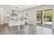 Open-concept kitchen with backyard access to patio and bbq at 10158 W Angels Ln, Peoria, AZ 85383