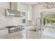 Modern kitchen with stainless steel appliances, granite countertops and subway tile backsplash at 10158 W Angels Ln, Peoria, AZ 85383