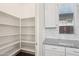 Walk-in pantry featuring adjustable shelving for ample storage at 10158 W Angels Ln, Peoria, AZ 85383
