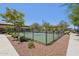 Pickleball court with a fenced enclosure provides a dedicated space for sports enthusiasts at 10158 W Angels Ln, Peoria, AZ 85383