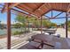 Covered picnic area with tables offers a shaded space for outdoor gatherings at 10158 W Angels Ln, Peoria, AZ 85383
