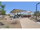 A colorful playground with modern play equipment and shaded seating areas for Gathering enjoyment at 10158 W Angels Ln, Peoria, AZ 85383