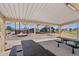 Covered picnic area with tables overlooking the playground in a well-maintained community park at 10158 W Angels Ln, Peoria, AZ 85383