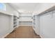 Spacious walk-in closet featuring shelves and hanging rods for optimal storage at 10158 W Angels Ln, Peoria, AZ 85383