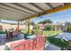 Inviting backyard patio with stylish furniture, perfect for outdoor relaxation and dining under a covered area at 1027 E El Camino Dr, Phoenix, AZ 85020