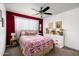 Cozy bedroom with a plush bed, soft lighting, and tasteful decor, creating a relaxing retreat at 1027 E El Camino Dr, Phoenix, AZ 85020
