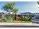 Charming single-story home with a well-maintained front yard and mature tree at 1027 E El Camino Dr, Phoenix, AZ 85020