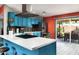 Bright kitchen featuring blue cabinetry, stainless steel appliances, and quartz countertops at 1027 E El Camino Dr, Phoenix, AZ 85020