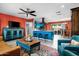 Open-concept living space with modern kitchen, stylish furnishings, and colorful accents at 1027 E El Camino Dr, Phoenix, AZ 85020