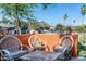 Outdoor patio featuring comfortable wicker seating, an orange wall, and city views at 1027 E El Camino Dr, Phoenix, AZ 85020