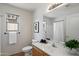 Bright bathroom featuring a vanity with a mirror, tiled floors, and updated fixtures at 10329 E Star Of The Desert Dr, Scottsdale, AZ 85255