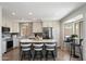 Modern kitchen with white cabinets, quartz countertops, and a stylish backsplash at 10329 E Star Of The Desert Dr, Scottsdale, AZ 85255