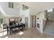 Open floor plan featuring a dining area, staircase, and modern fireplace at 10329 E Star Of The Desert Dr, Scottsdale, AZ 85255